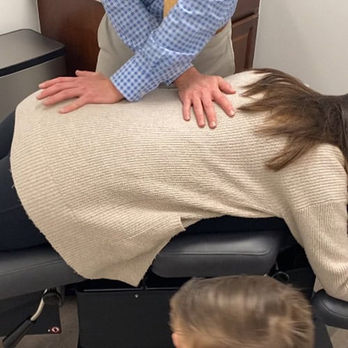 Dr. Dillan treating patient for Back Pain